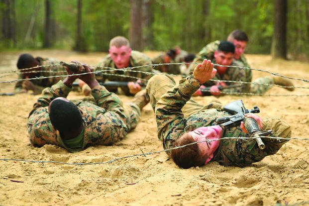 Marines maneuver through an obstacle during the combat endurance course aboard Marine Corps Recruit Depot Parris Island (Photo by Benjamin McDonald)